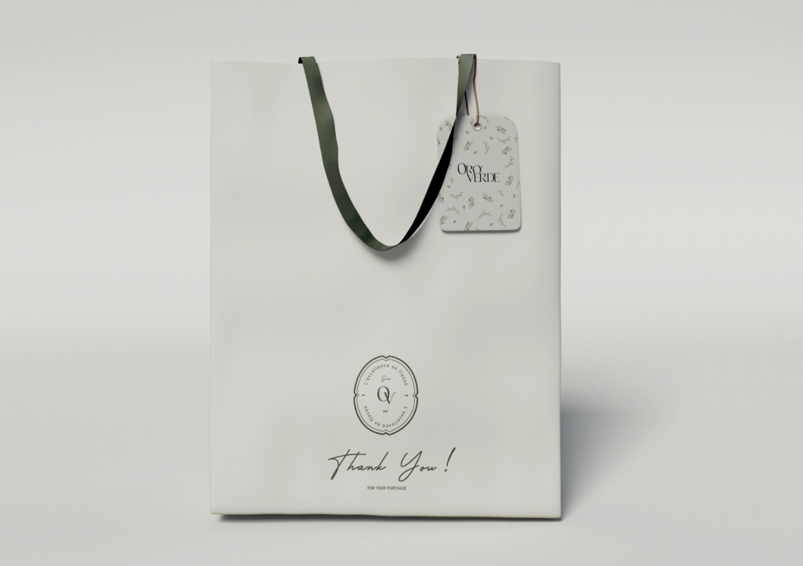Sac blanc avec une poignée noire et un tag blanc marqué 'Oro Verte', portant un logo et le message 'Thank You!'