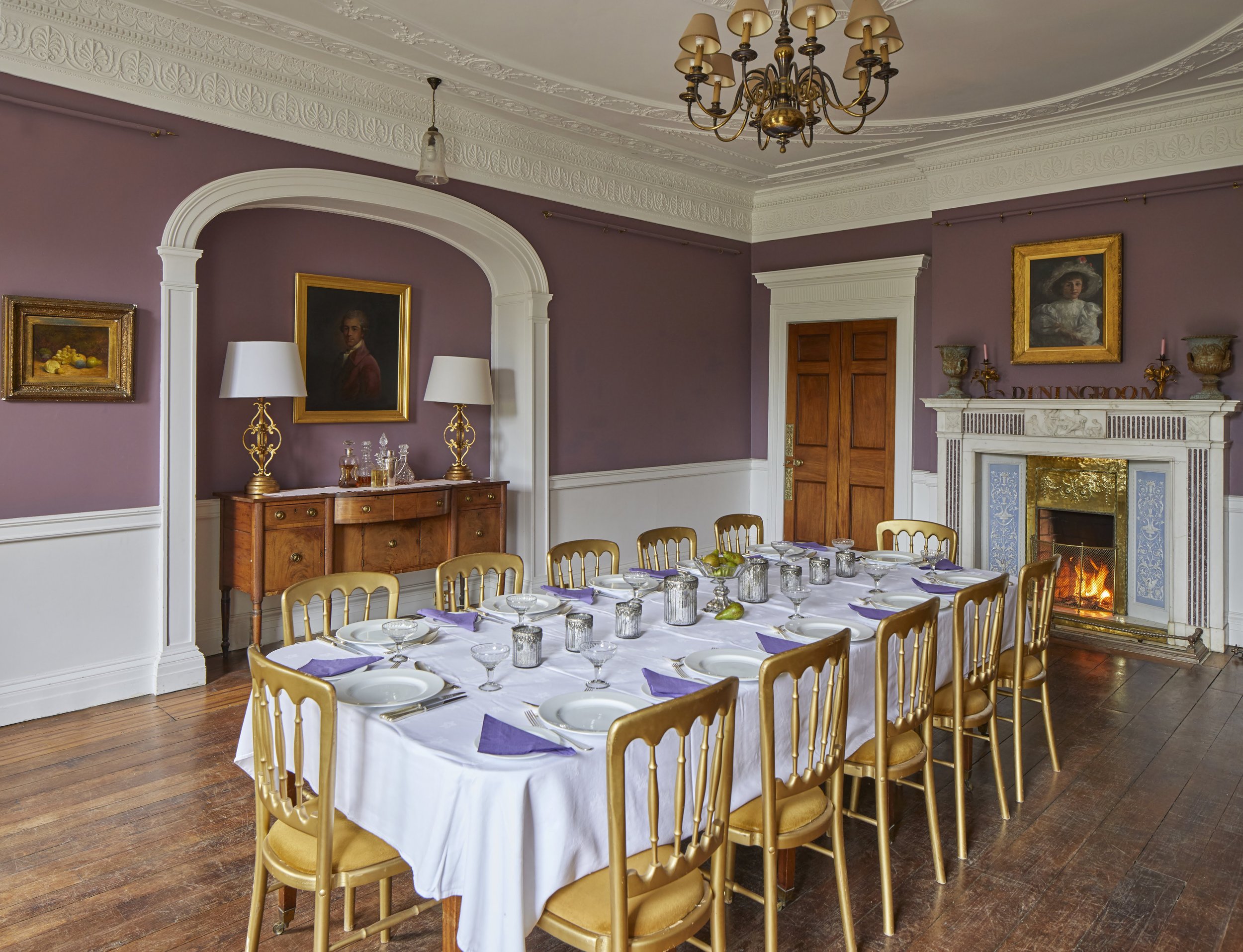 Dining room with table laid for dinner