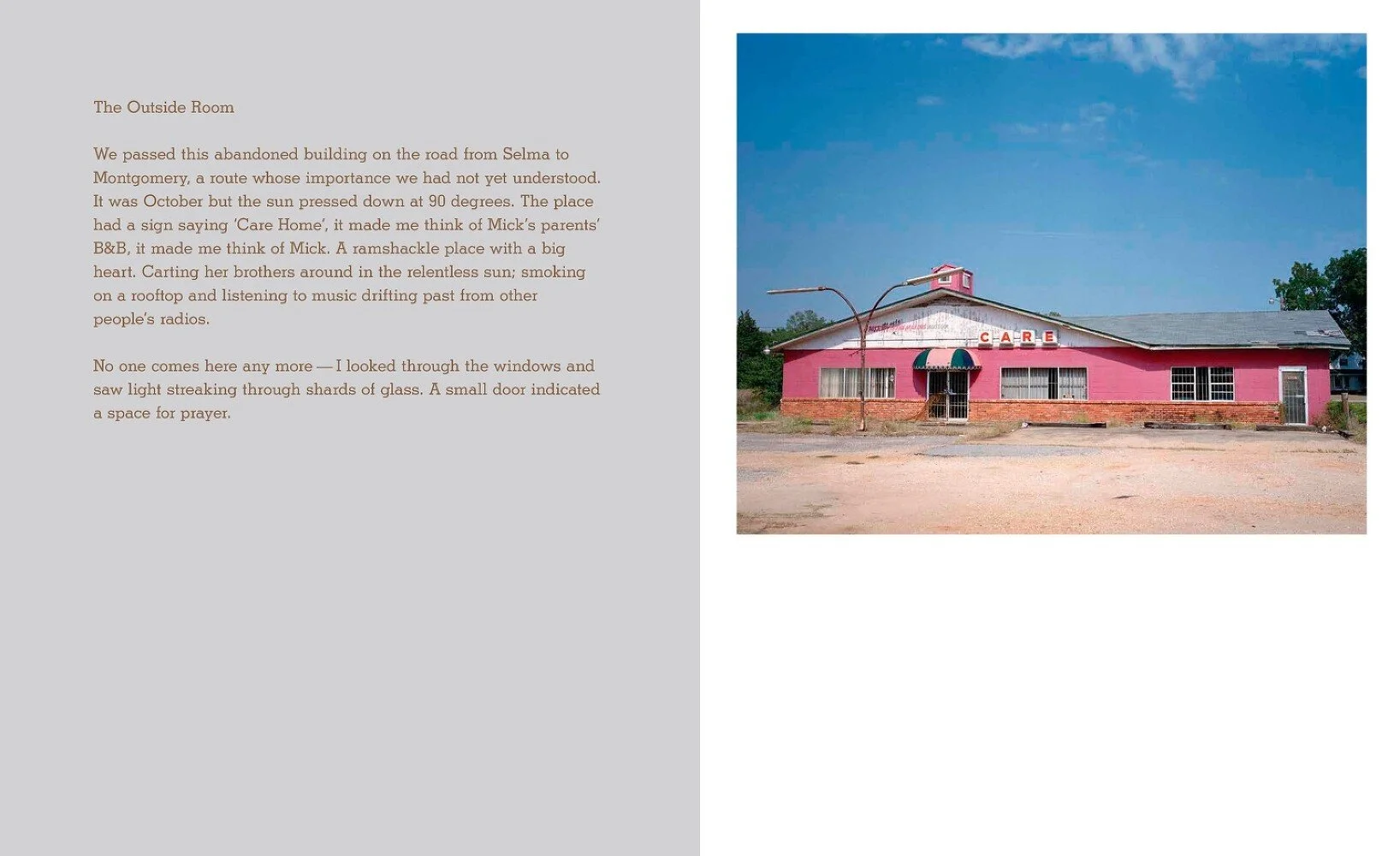 A pink abandoned building with a sign reading 'CARE' on the roof, single story with large windows, brick foundation, and a small front door, under a blue sky.