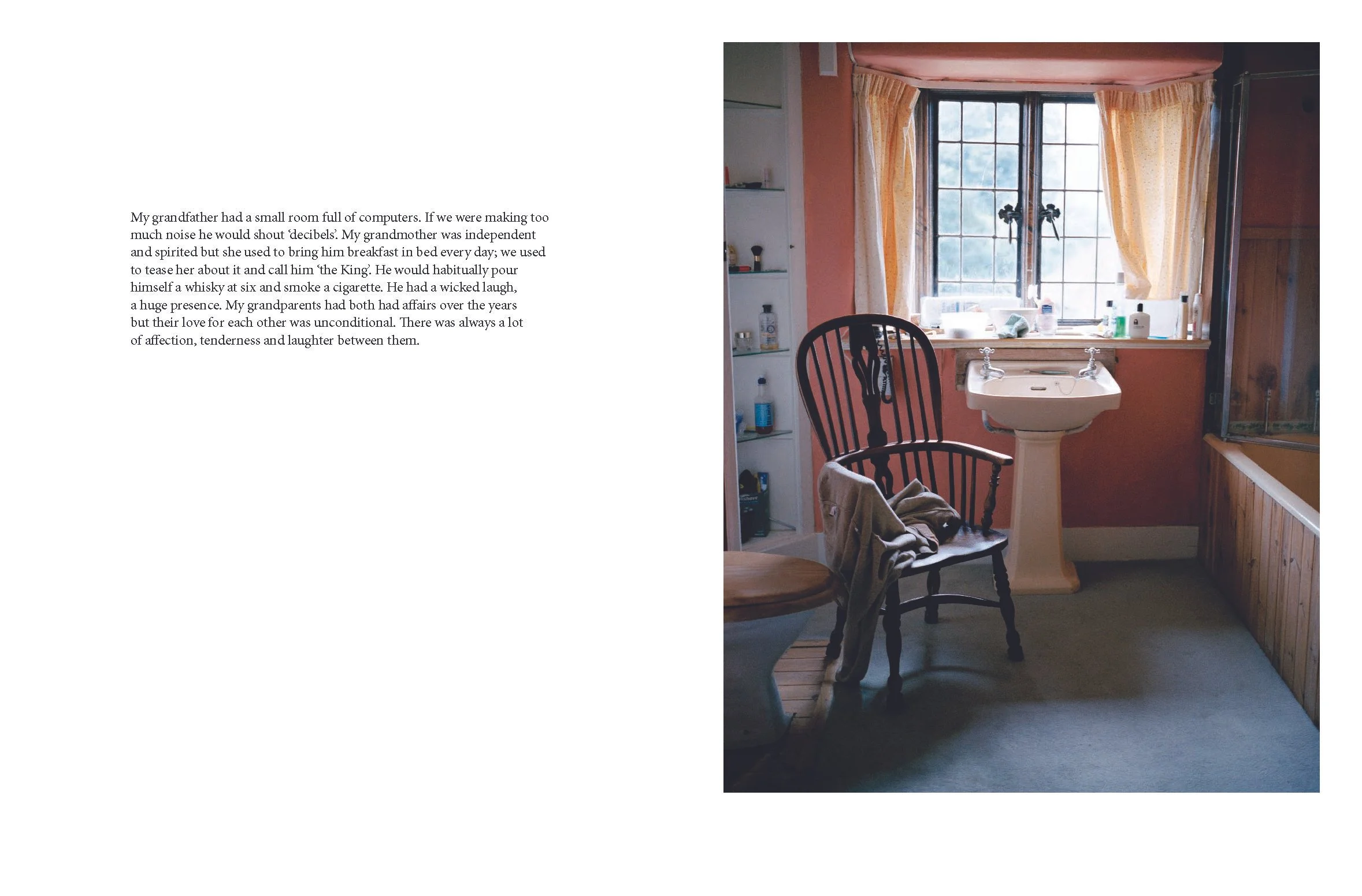 A cozy bathroom with a large window, yellow curtains, a pedestal sink, a wooden chair with a towel draped over it, and a corner bathtub with a glass shower enclosure.