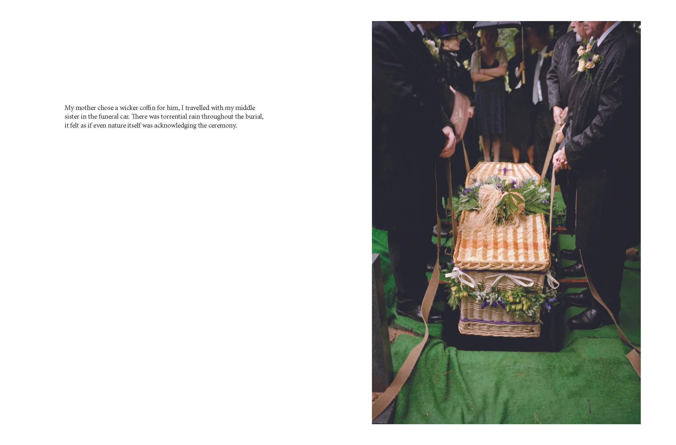 People dressed in black attending a funeral service around a wicker casket decorated with flowers.