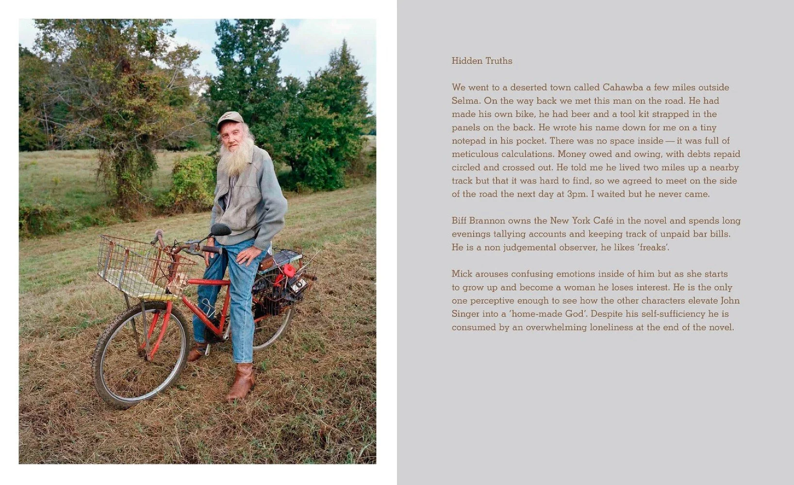 An elderly man with a long white beard, wearing a beige cap, gray jacket, blue jeans, and brown boots, standing beside a red bicycle with baskets on a grassy field with trees in the background.