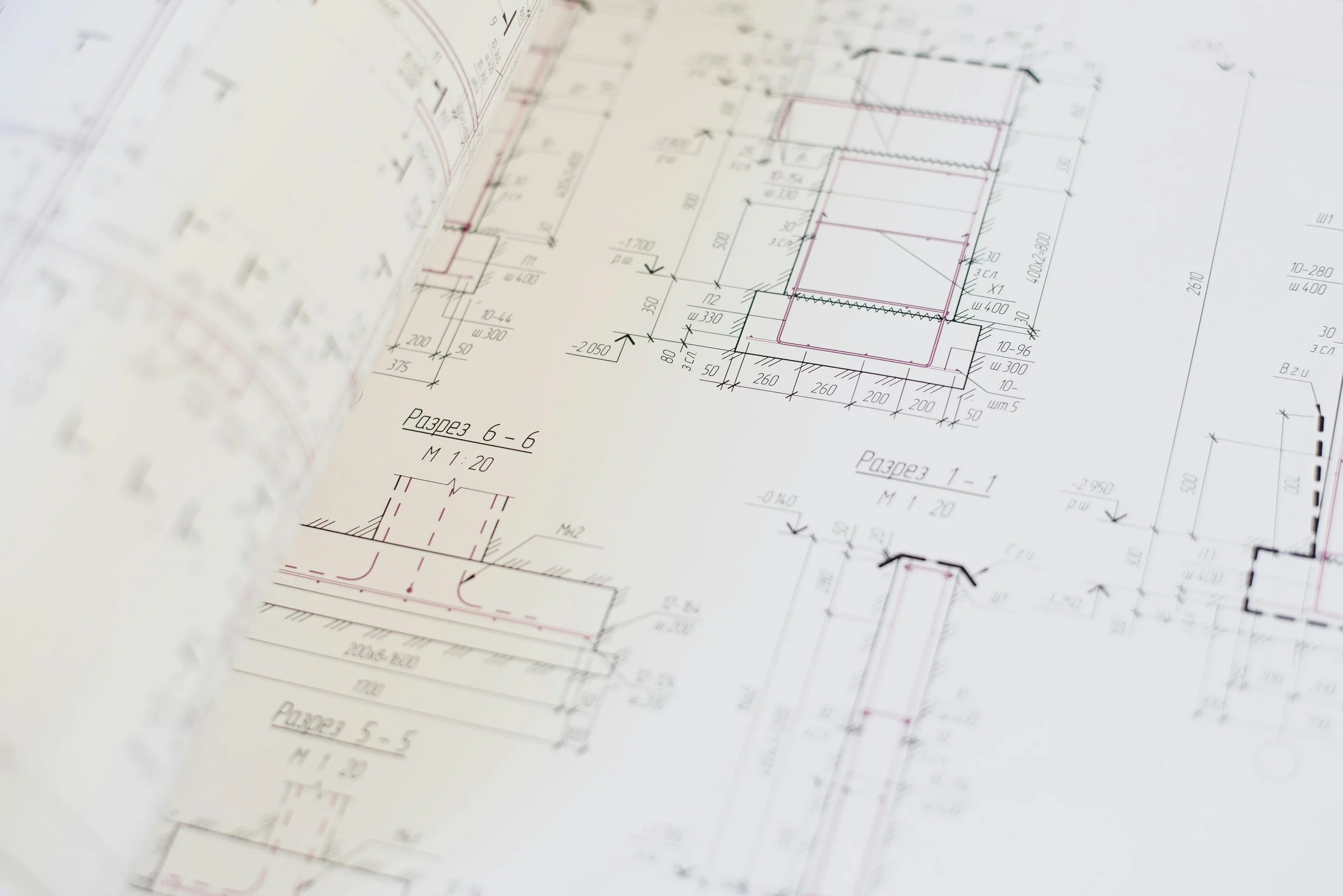 Detailed architectural blueprint with various measurements and sections, showing structural drawings.