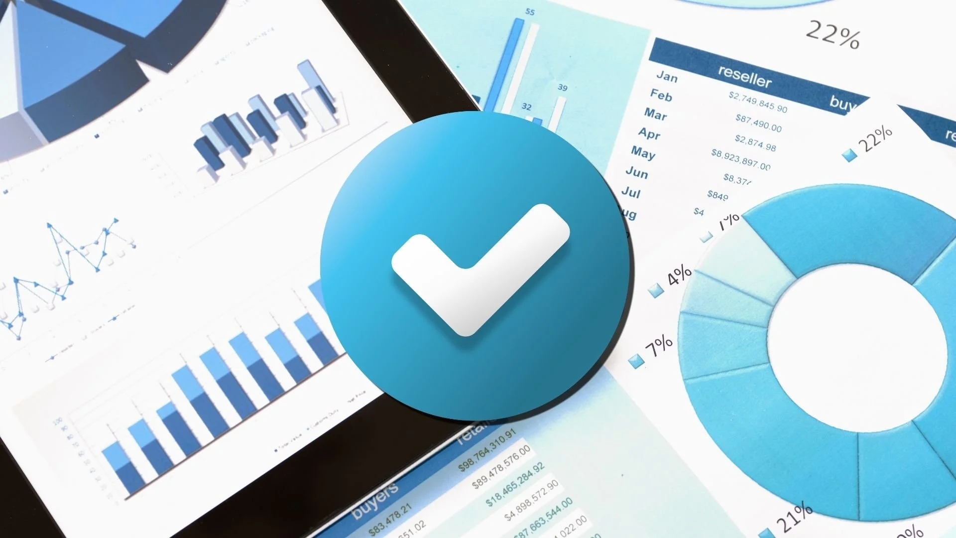 A blue checkmark icon overlapping various business charts and graphs, including pie charts, bar graphs, and line charts, displayed on a tablet screen.