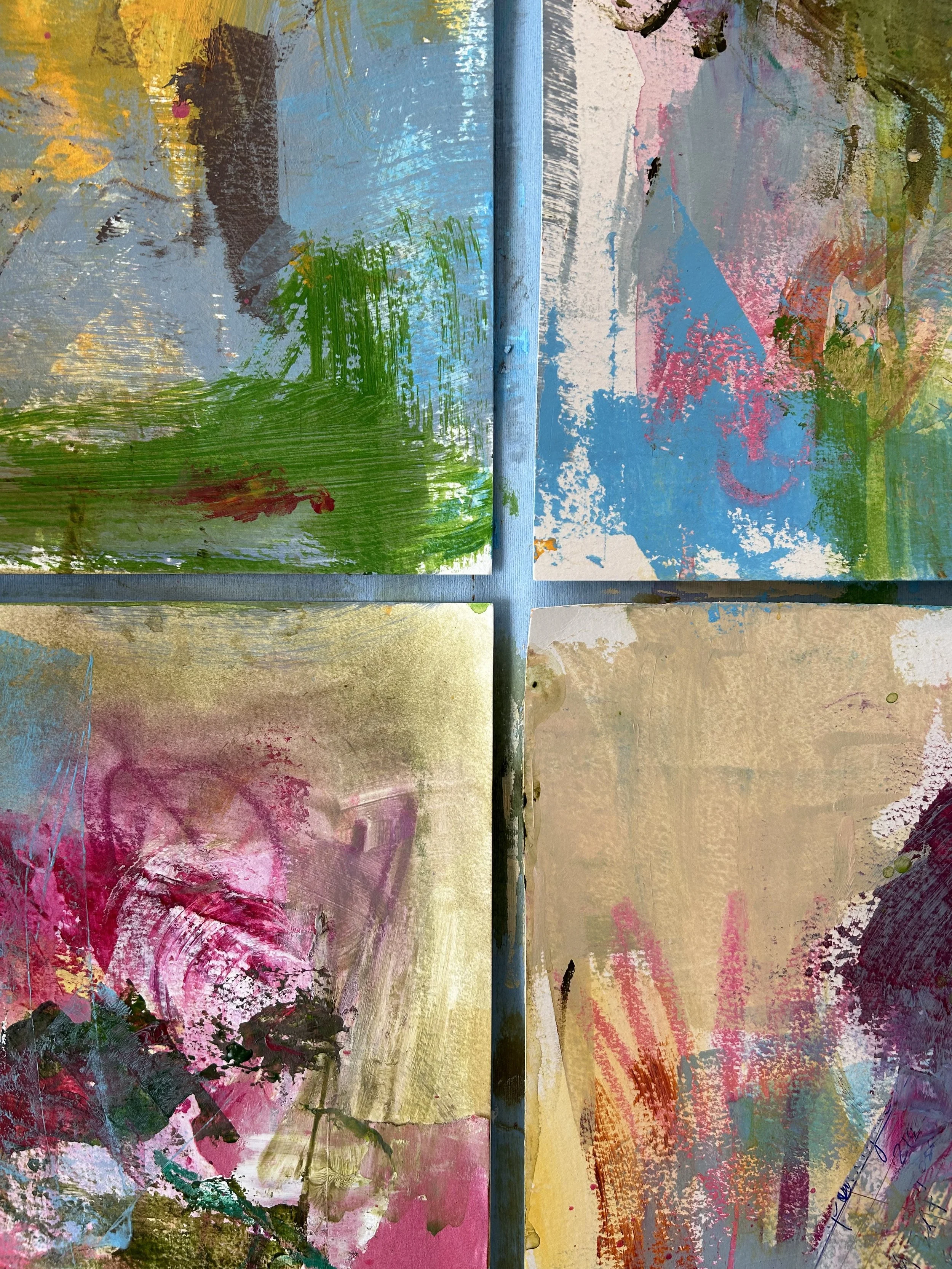 A close up of colorful paintings on paper
