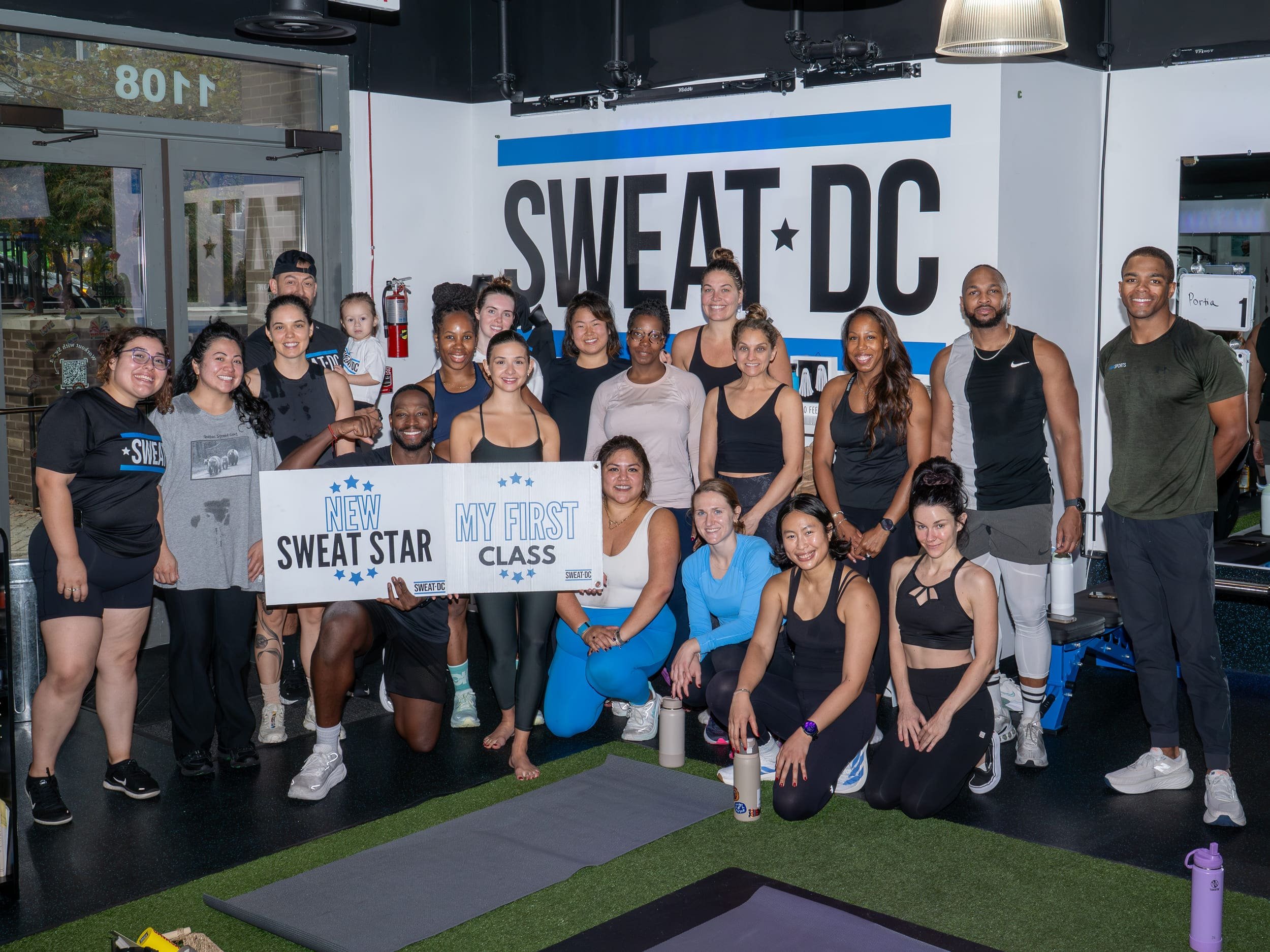 A group photograph of the founder of Su and Soul, the founder of Sweat DC, and all the pop-up attendees