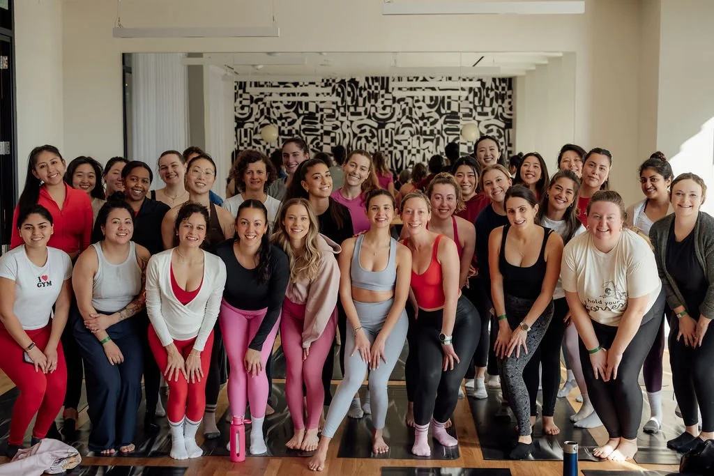 A group photograph of Cagla and several participants after the Self Love Club pop-up event