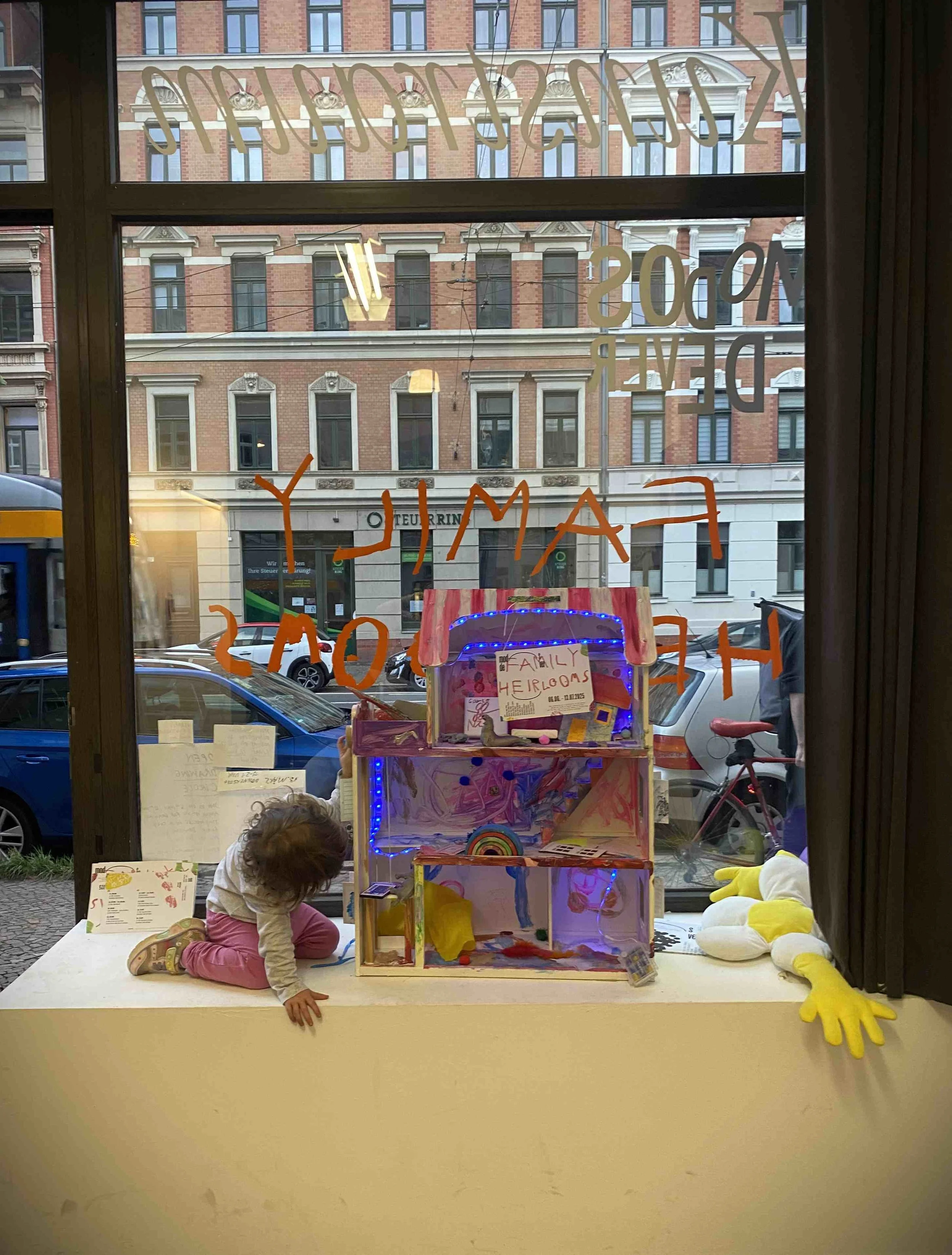 photo of a child playing with a dollshouse.jpg
