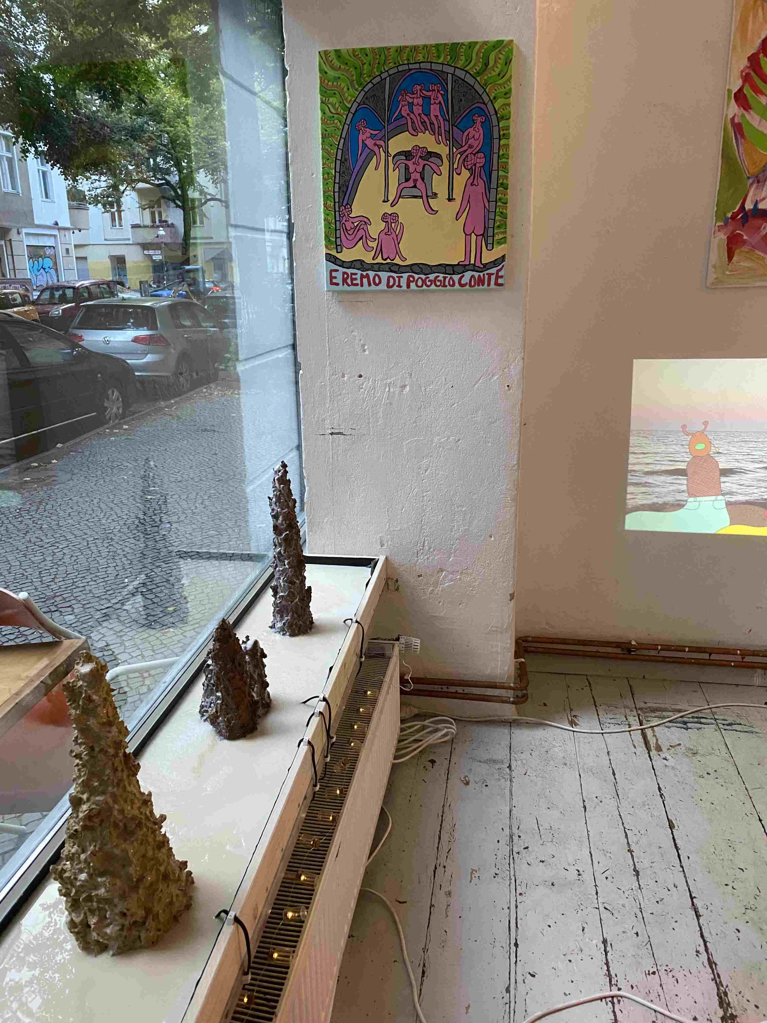 exhibition shot with rainy street view and sculpture and painting.jpg