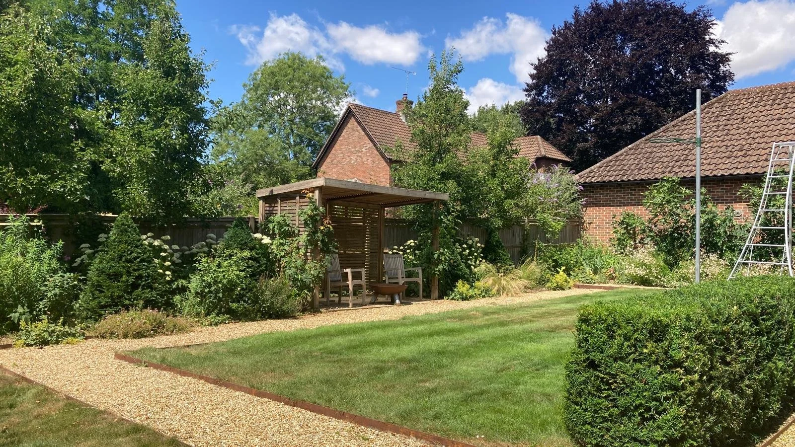 Arbour with seating and fire pit