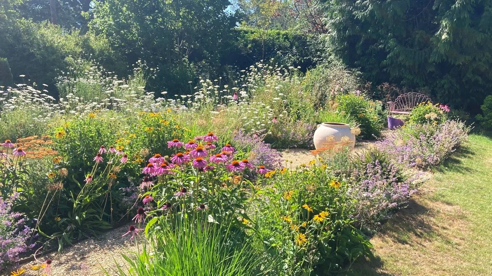 Cottage style planting with a terracotta urn centrepiece
