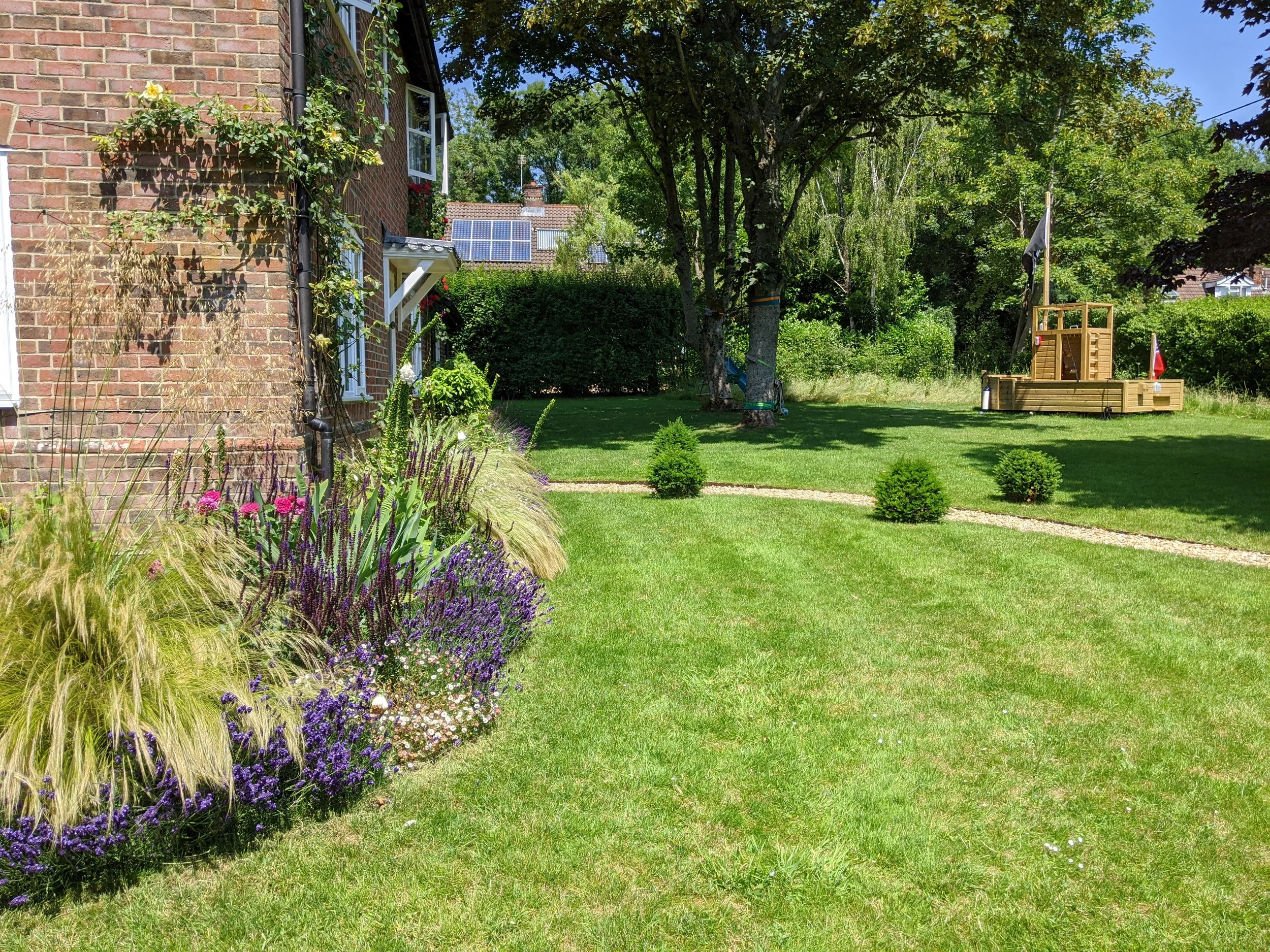 View across lawn to children's play area