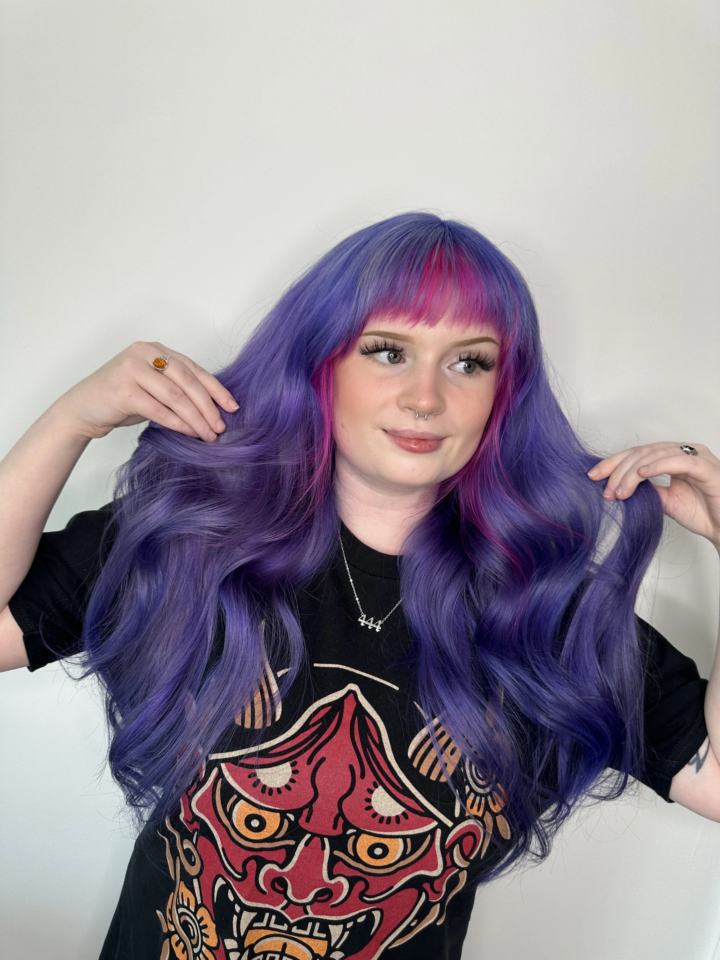 Vivid hair colour, purple and pink.