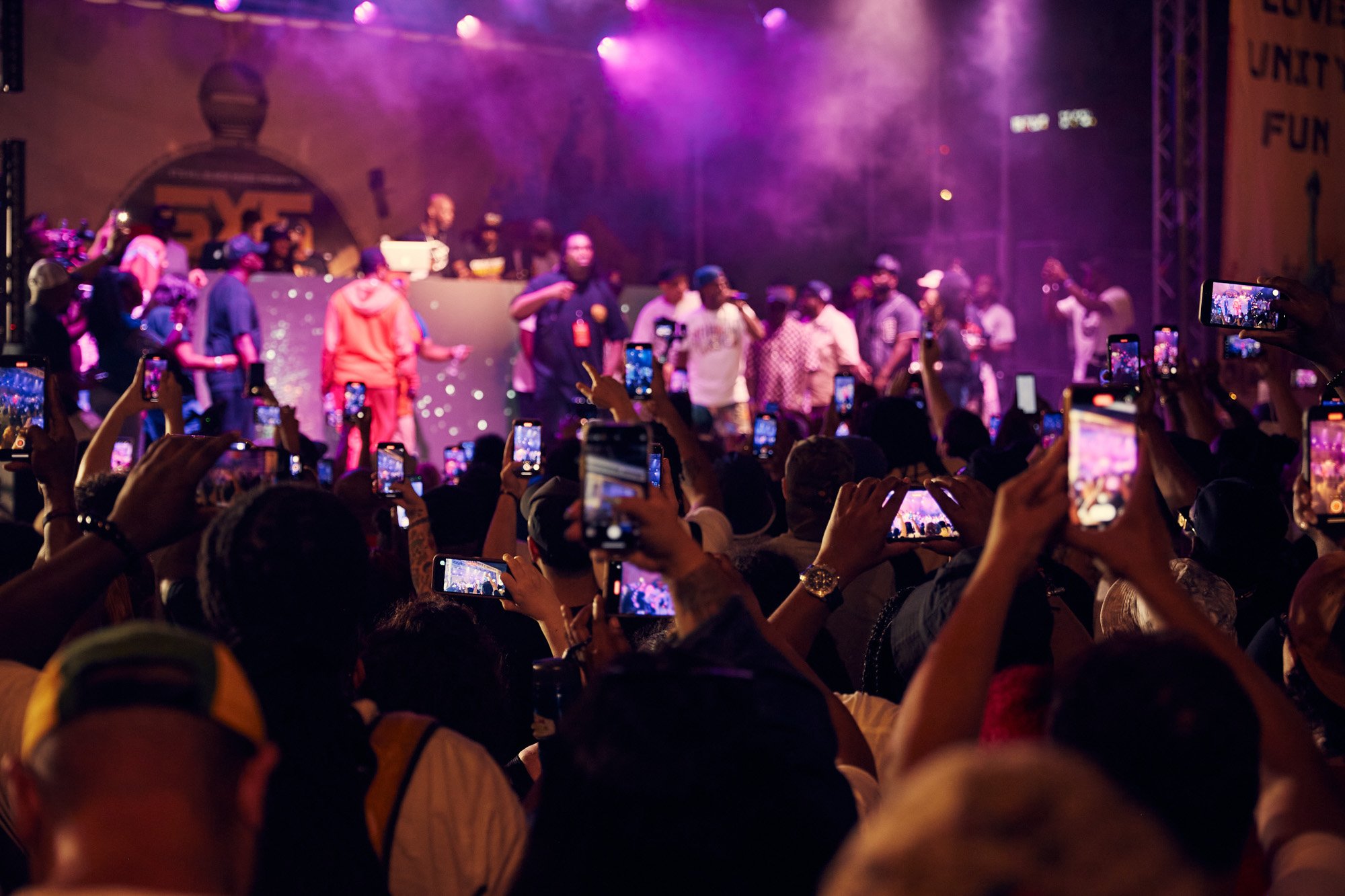 julianwalter-stage-phones-crowd-50yearshiphop-sedgwick-bronx-nyc.jpg