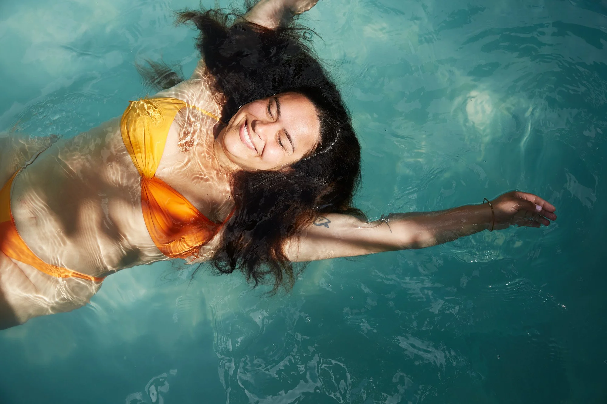 woman-smiling-pool-tropical-julianwalter.jpg