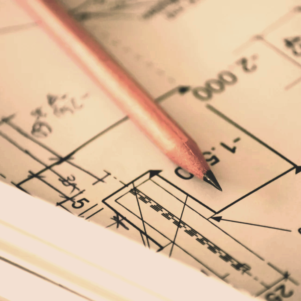Close-up of a technical drawing with precise measurements, lines, and a pink mechanical pencil resting on the paper.