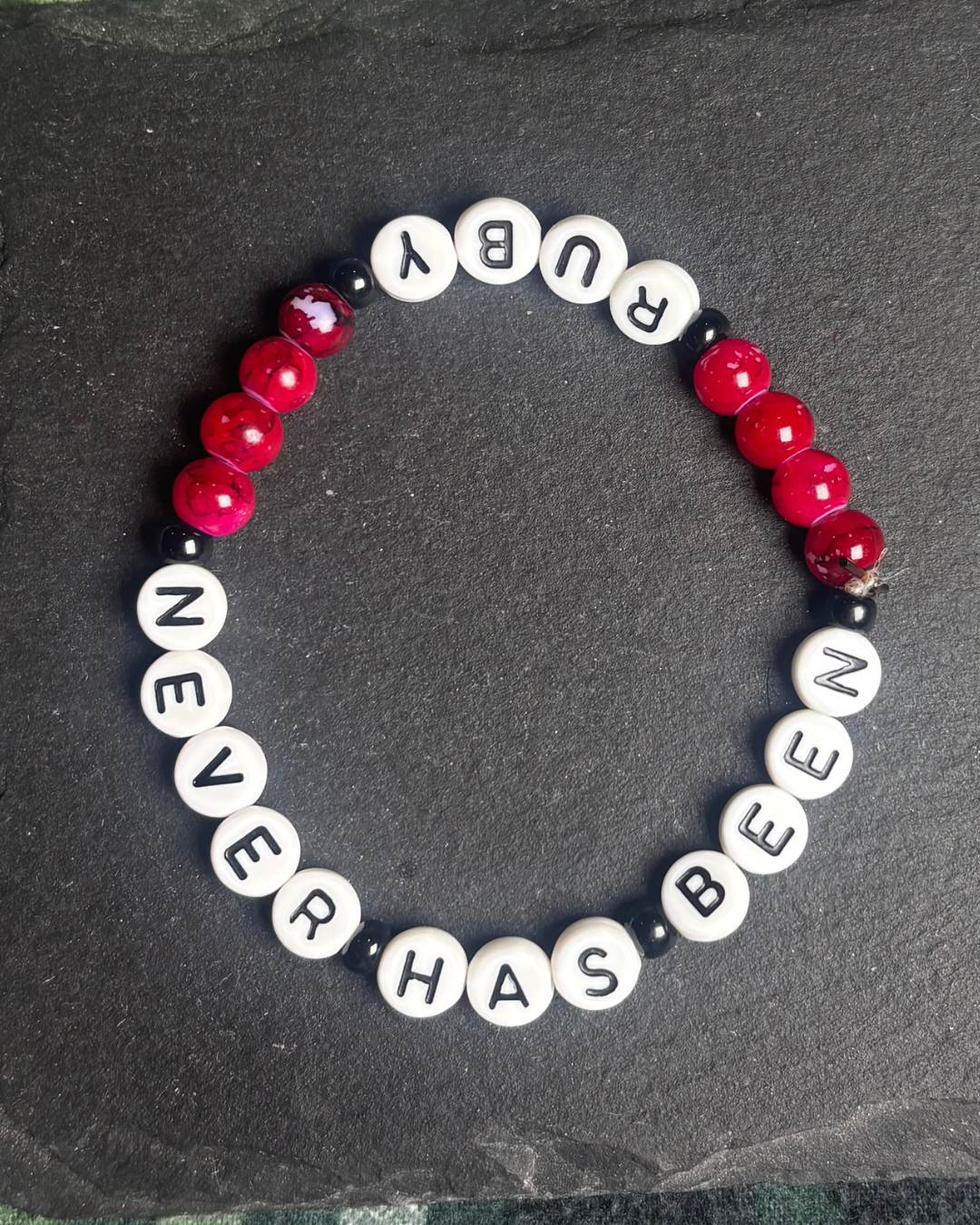 Never has been bracelet merch.png