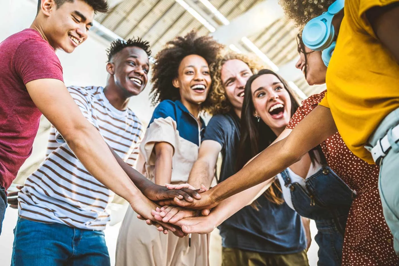 Teens stack hands to volunteer