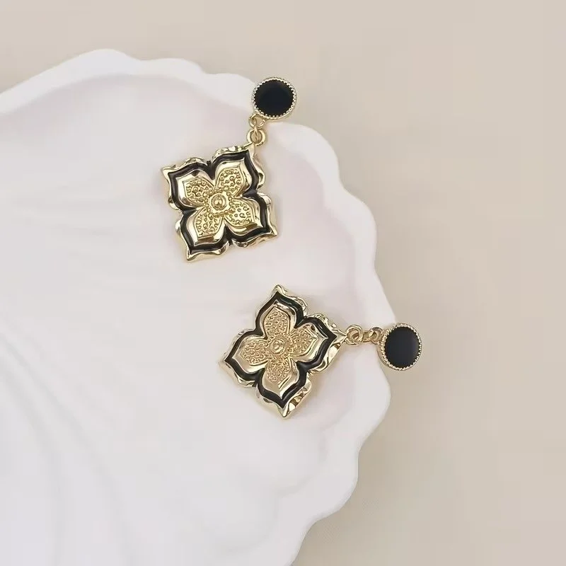 Clover Flower Earrings with Black Enamel and Gold-Plated Motifs