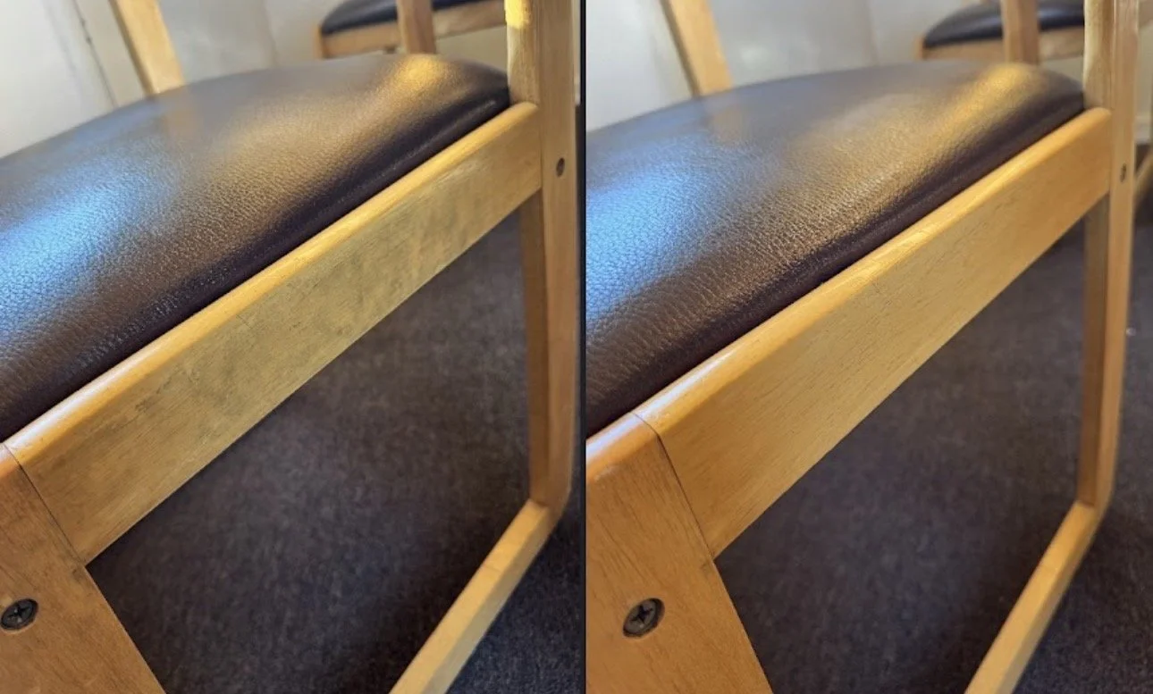 Close-up of a wooden chair with a brown leather cushioned seat, showing slight color and texture differences.