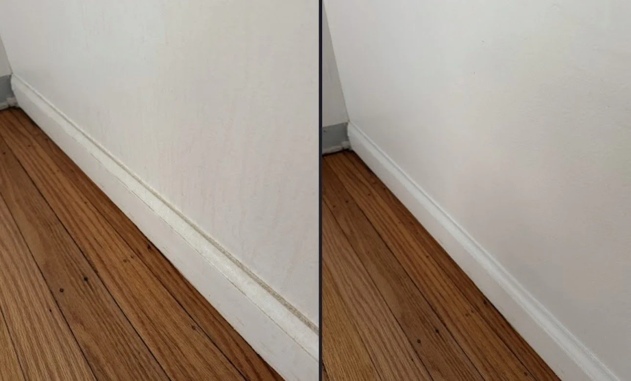 Comparison of a dirty baseboard and a clean baseboard along a hardwood floor.
