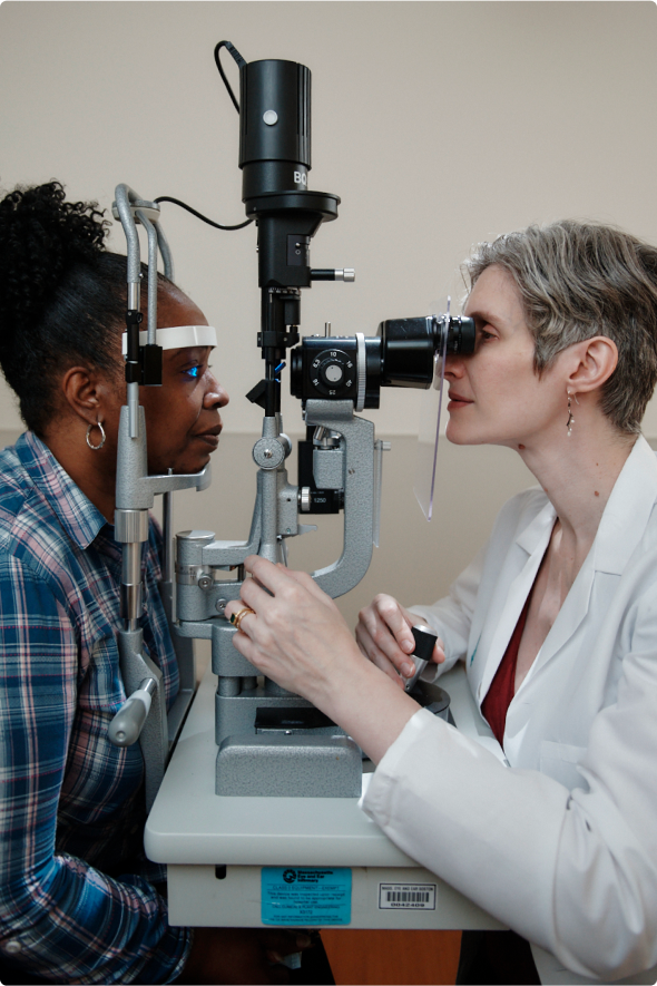 Eye examination with a slit lamp at an eye clinic.
