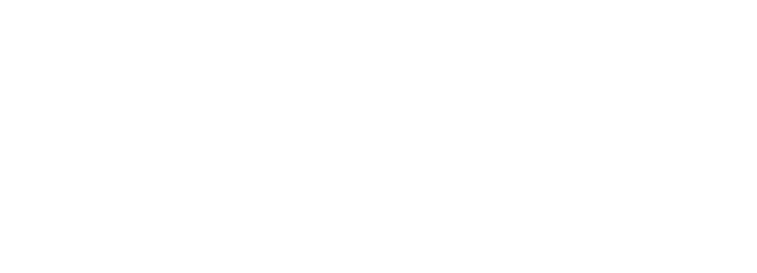 A person seated on a stool playing a guitar in a room with a vintage style.