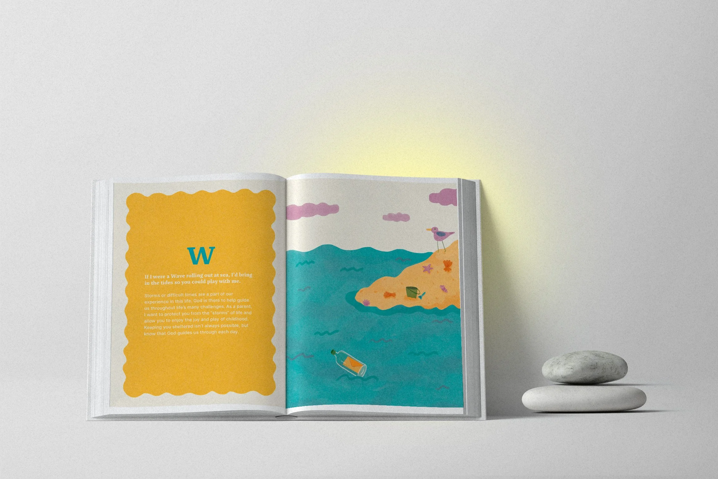 Open children's book with colorful illustration of a seaside scene with a bird on the shore, a floating bottle in the water, and a small boat, placed next to stacked white stones on a light gray background.