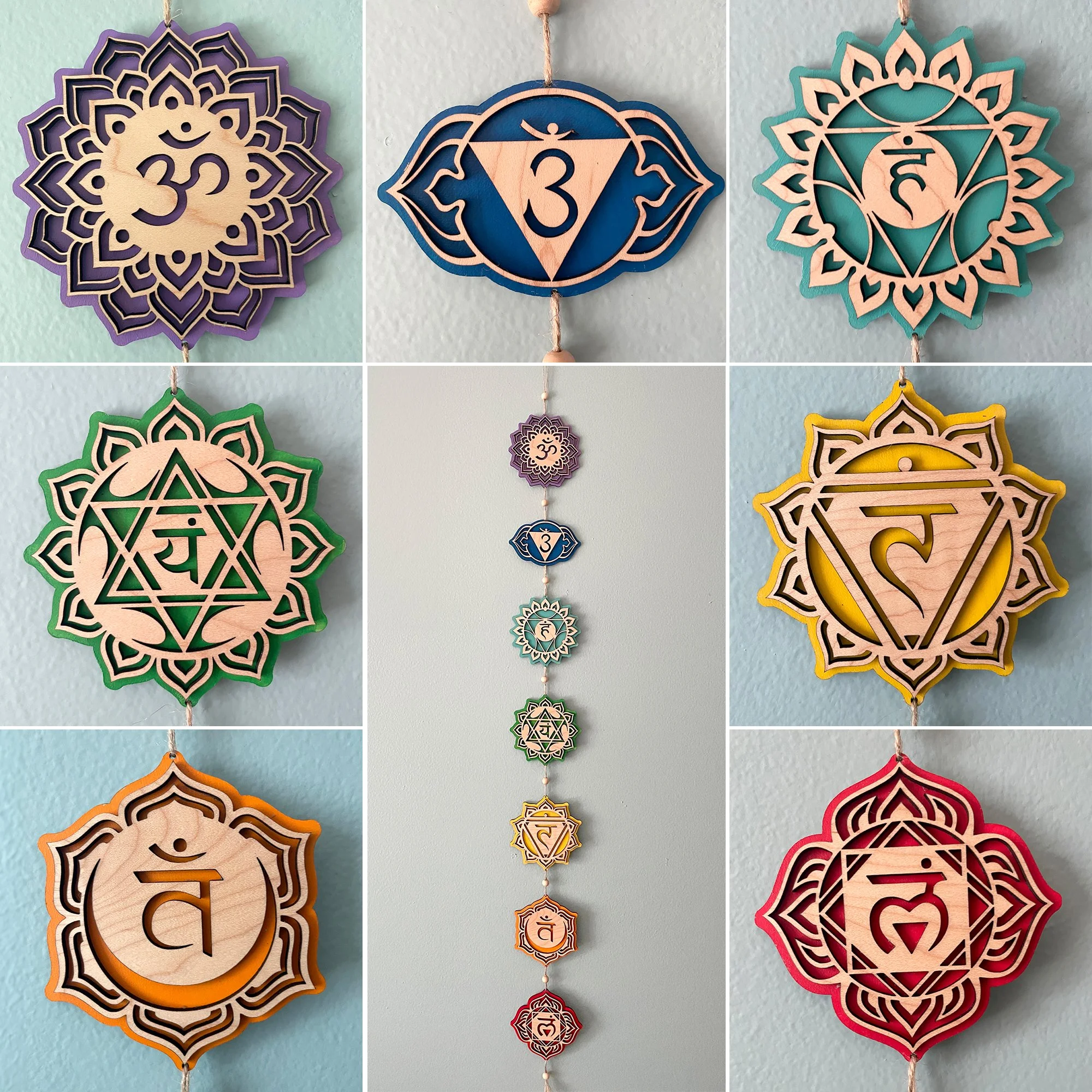 Decorative hanging wooden symbols representing the seven chakras, each with a unique color and symbol, arranged vertically.