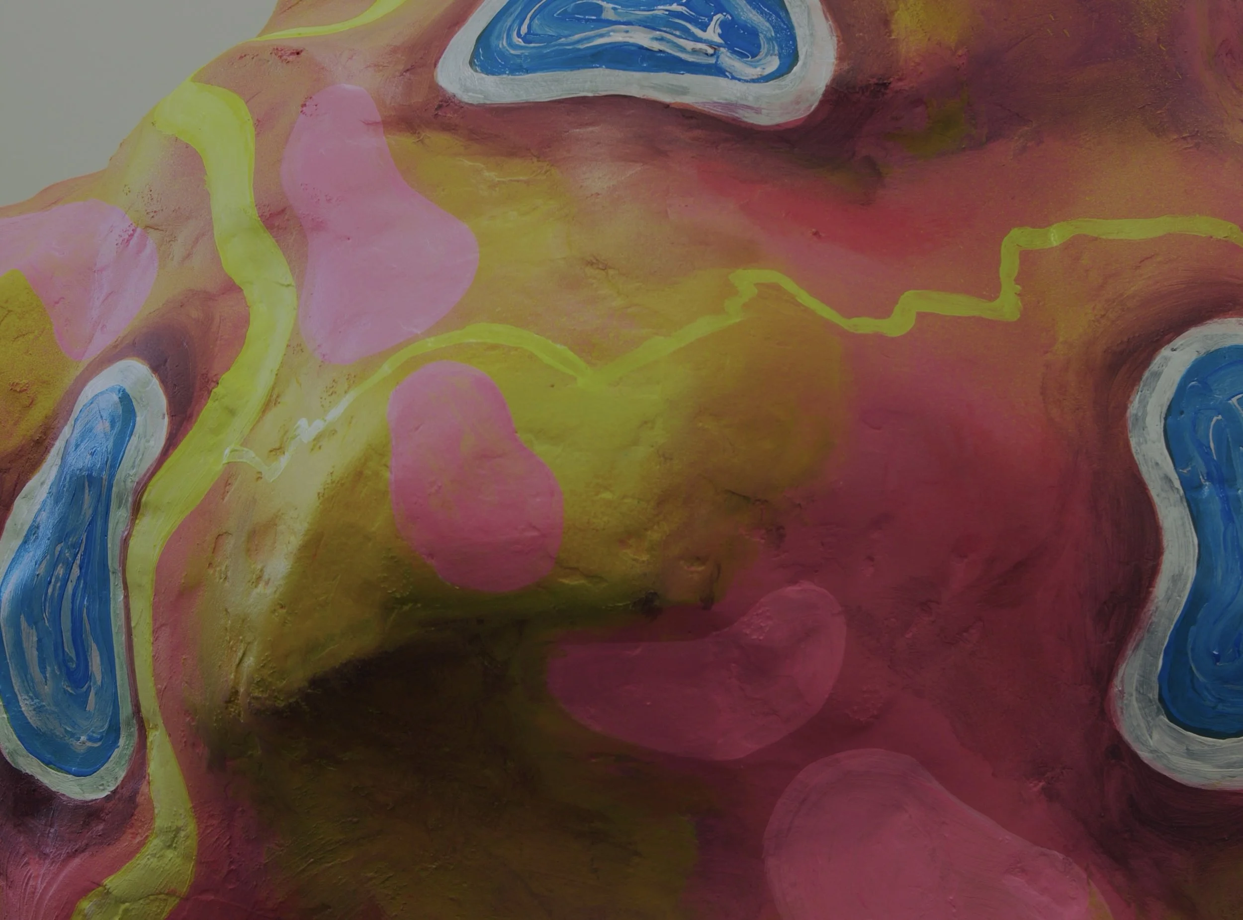 Abstract art with pink, yellow, blue, and white swirls and blobs