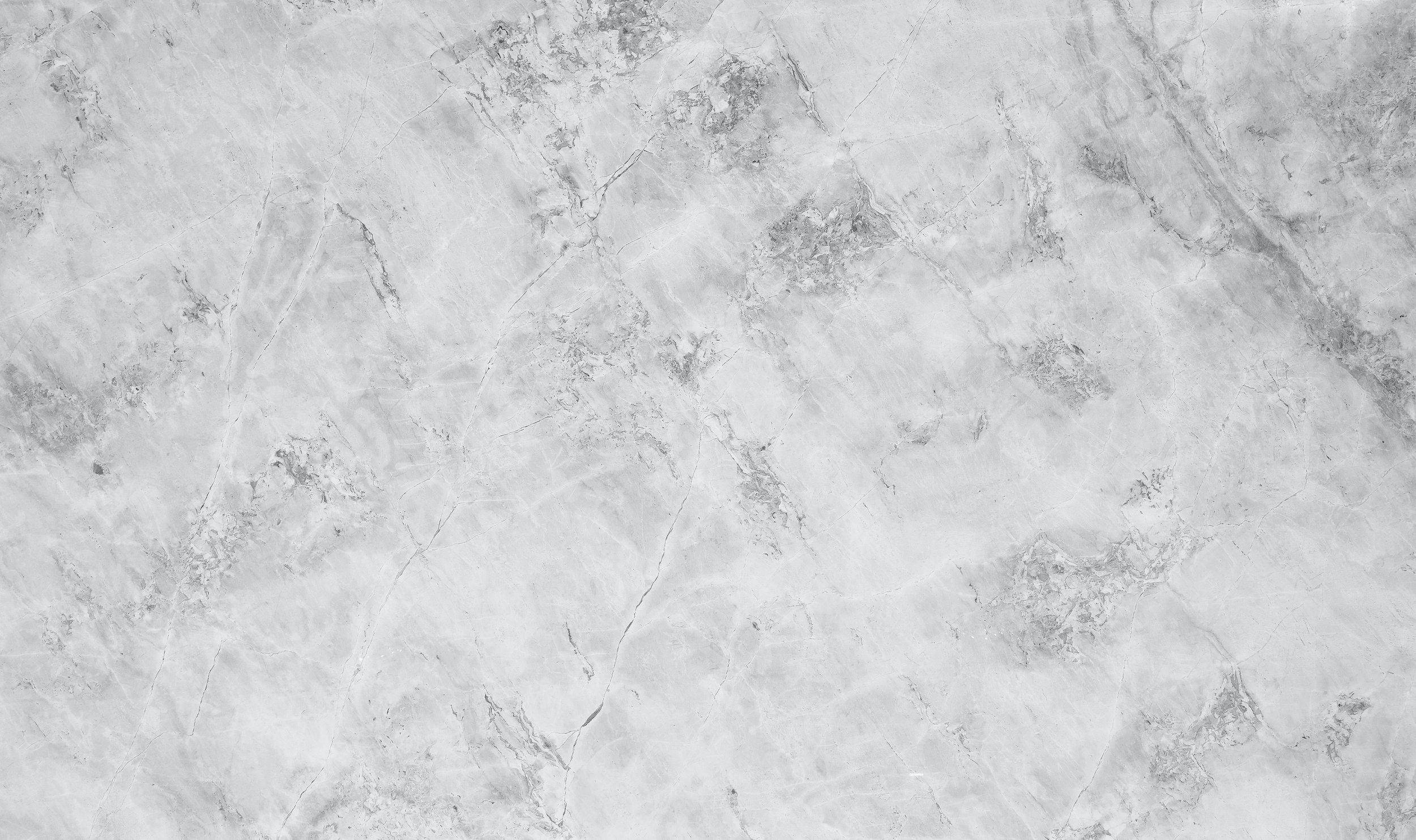 Gray marble-like textured surface with natural veining.