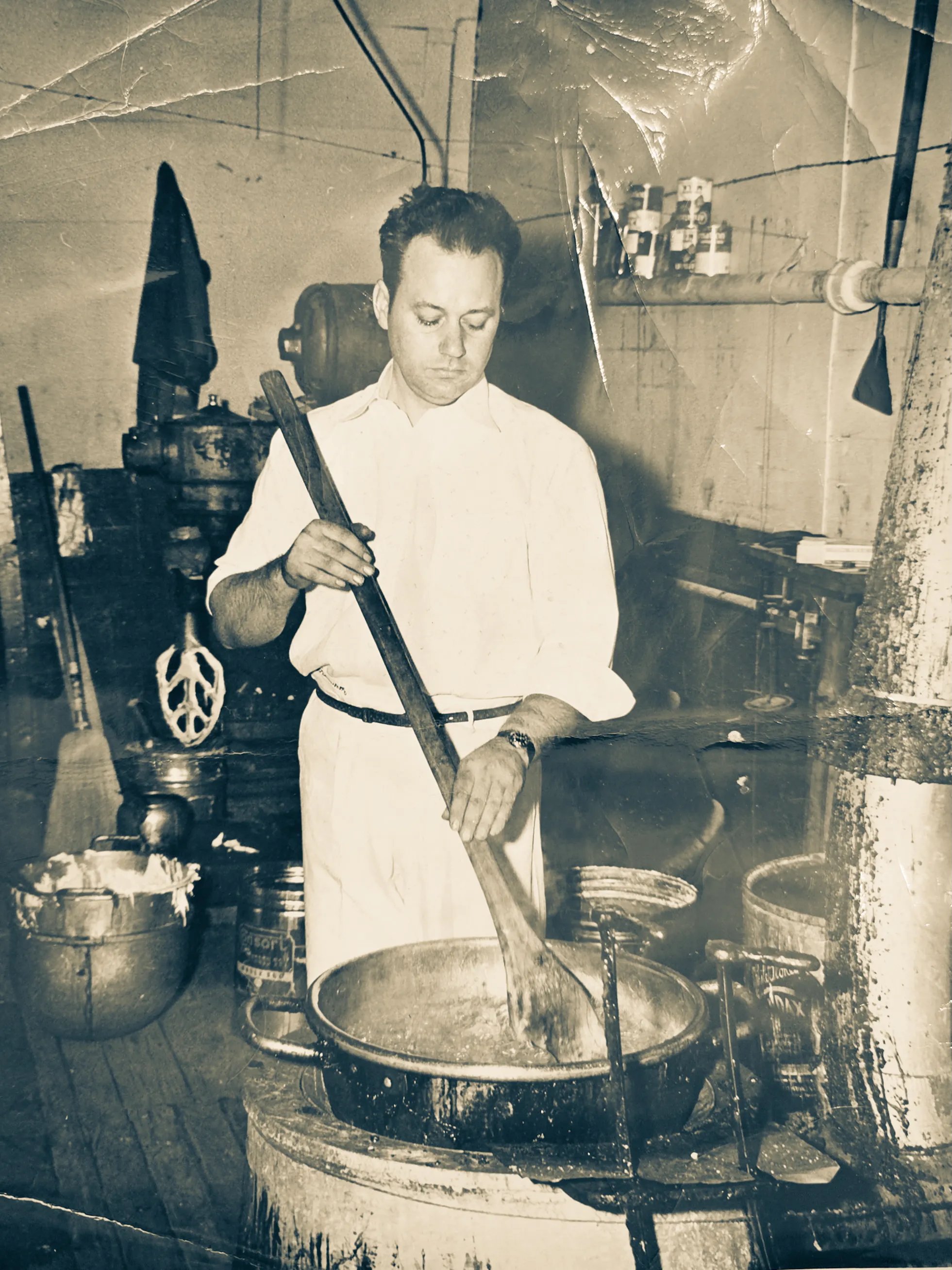 Old photo of Lamar Trammell making candy in an old copper pot
