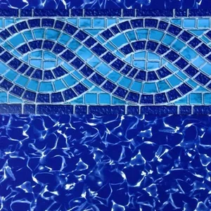 Close-up of a blue mosaic tile pattern with decorative swirls, above a shimmering blue water surface.
