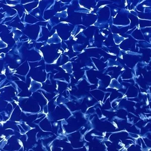 Close-up of a blue swimming pool's water surface with shimmering reflections.