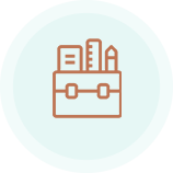 A box containing books and a ruler against a teal background.