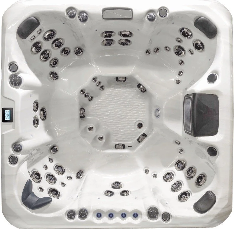 Top view of a white hot tub with multiple jets and control panel.