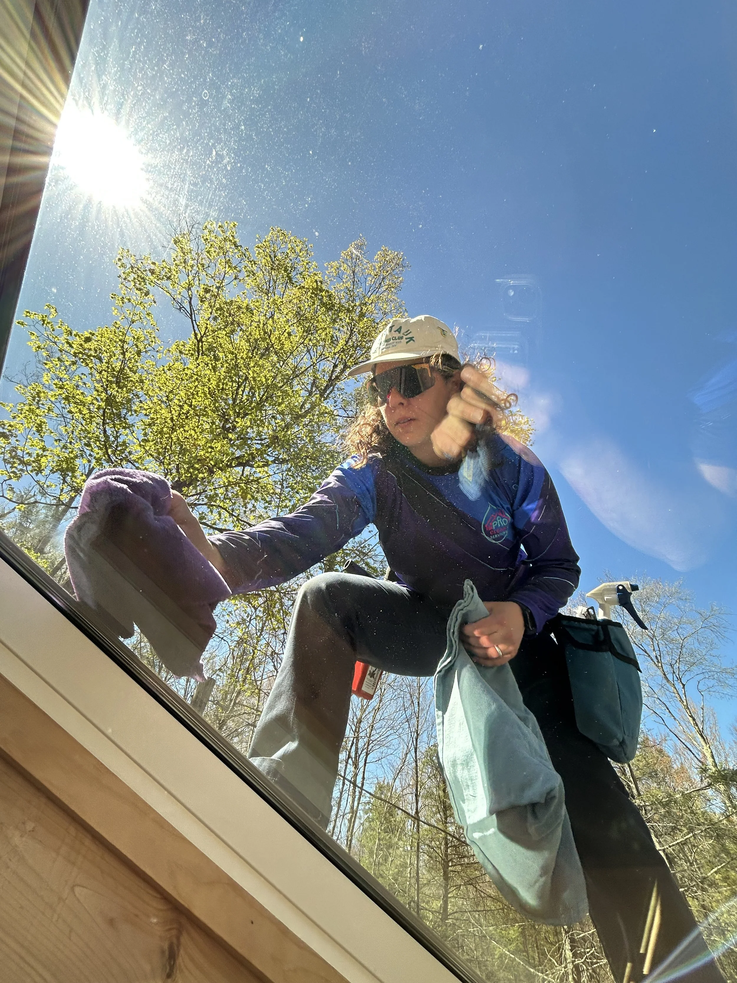 Professional exterior window cleaning service using traditional tools on a residential home in the Catskills and NEPA region.