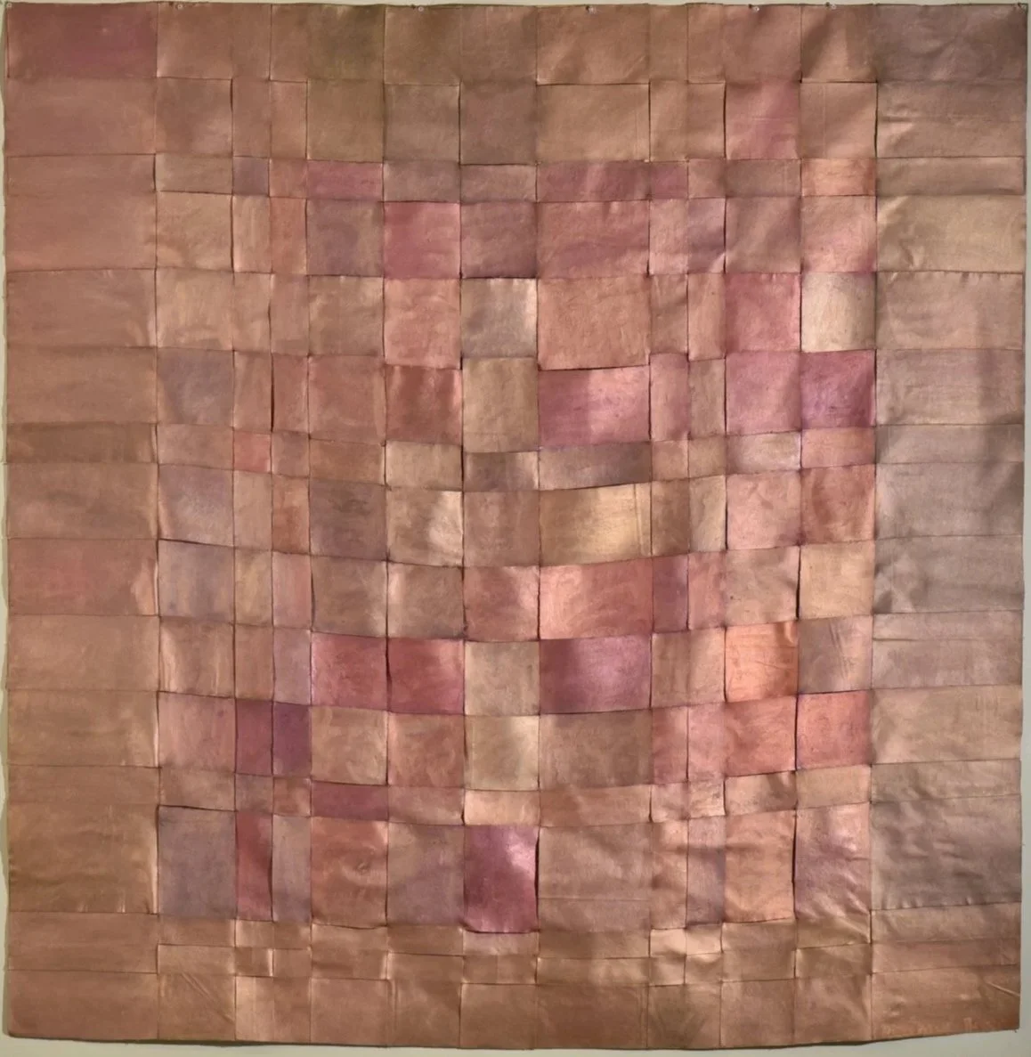 Abstract metallic oil paint weaves together in shades of subdued cherry, brown, and muted earthy mauve. Work by Massachusetts feminist artist