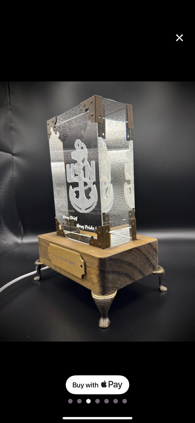 A decorative trophy with a wooden base, metal accents, and a clear crystal panel engraved with an anchor and the words 'Navy Chief' and 'Navy Pride'.
