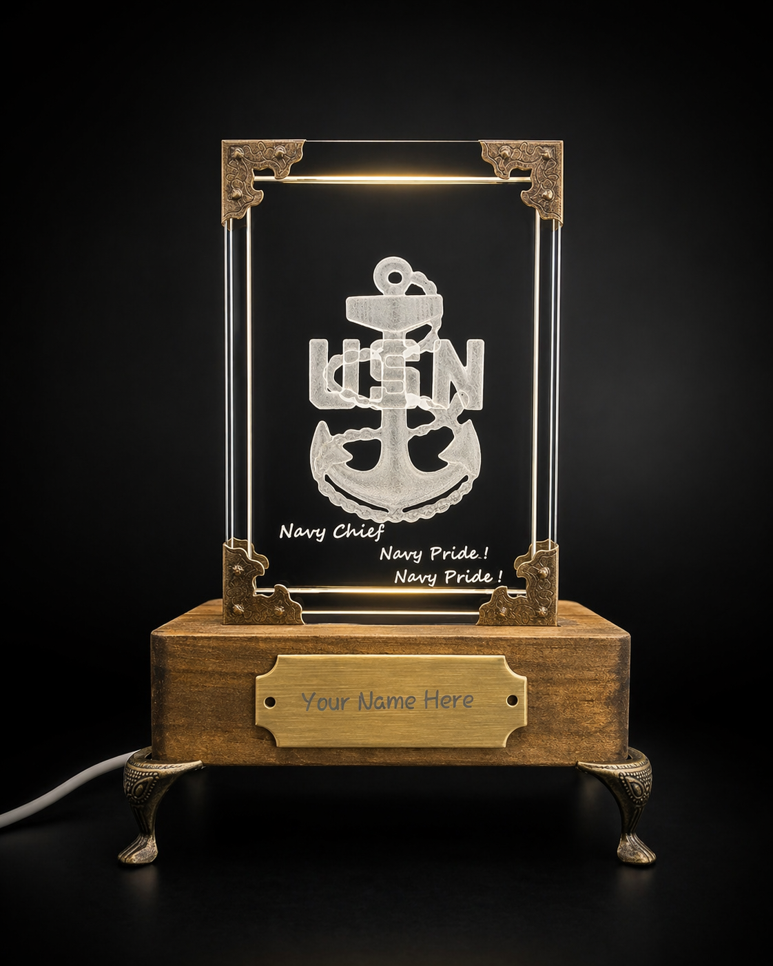 PromilleoGlass GhostGlass monument featuring a US Navy Chief anchor etched in crystal glass with an illuminated wood base and brass nameplate.