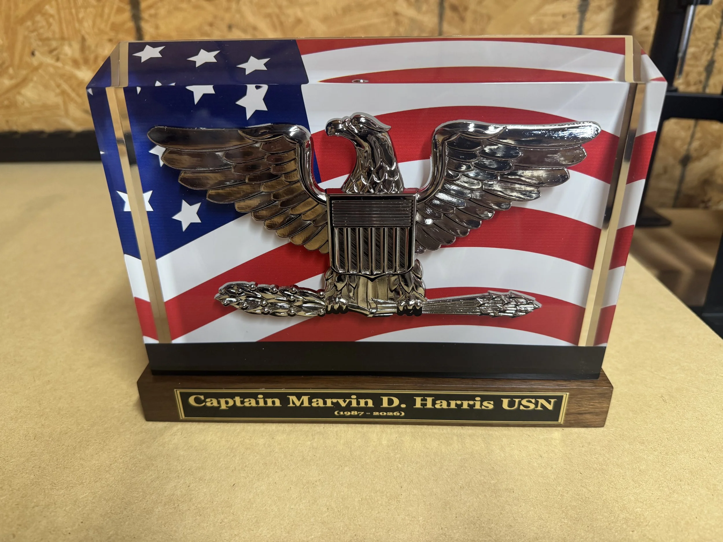 PromilleoGlass BallistiGlass(TM) Monuments.  Highly detailed 120mm or 200mm scaled emblem, insignia, or badge replica suspended in a single thick slab of ballistic glass.   Brass nameplate with custom text included.  Navy Captain featured here.
