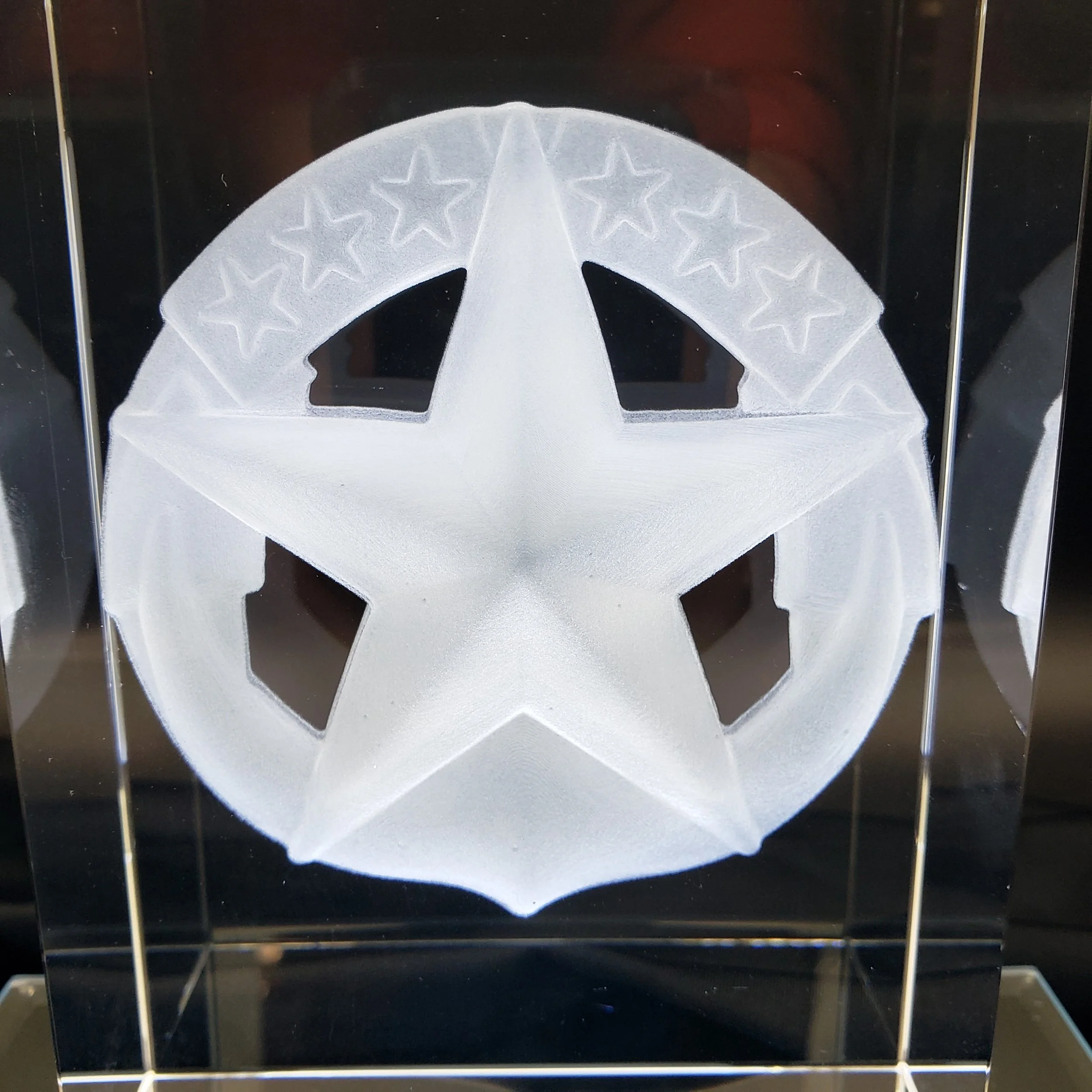 A GhostGlass custom 3d engraved block with a frosted US Navy Command at Sea Badge.