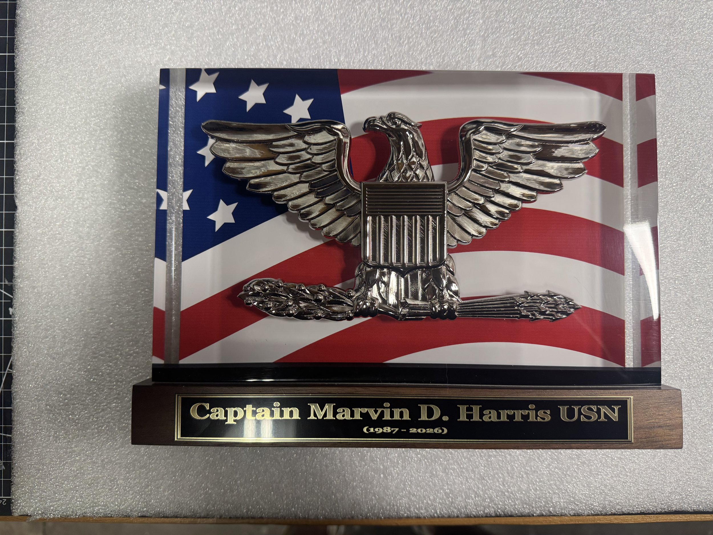PromilleoGlass BallistiGlass(TM) Monuments.  Highly detailed 120mm or 200mm scaled emblem, insignia, or badge replica suspended in a single thick slab of ballistic glass.   Brass nameplate with custom text included.  Navy Captain featured here.