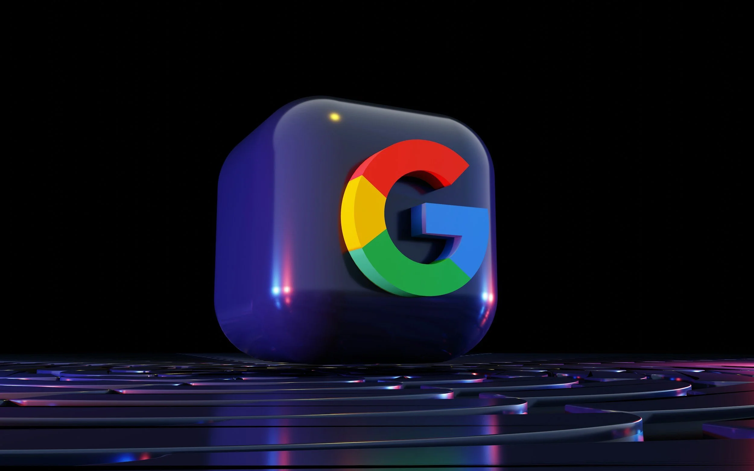 3D illustration of the Google logo inside a reflective, rounded blue cube on a dark background.