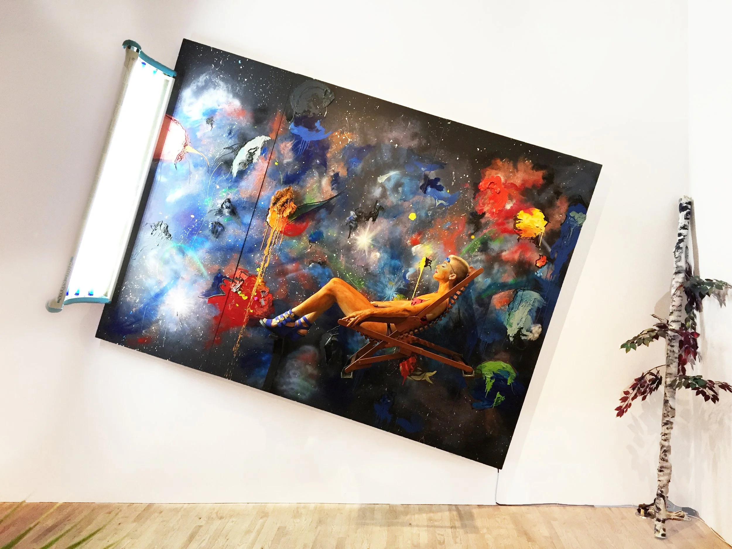 Jen Catron and Paul Outlaw, Tanning bed with ambience (Luminiferous aether), 2016, acrylic and spraypaint on canvas w/
tanning bed, relaxation chair, cactus, 96 x 132 x 36 inches,