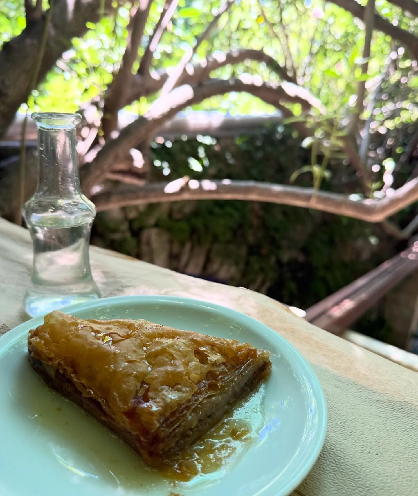 Baklava served on a turquoise plate in Greece.