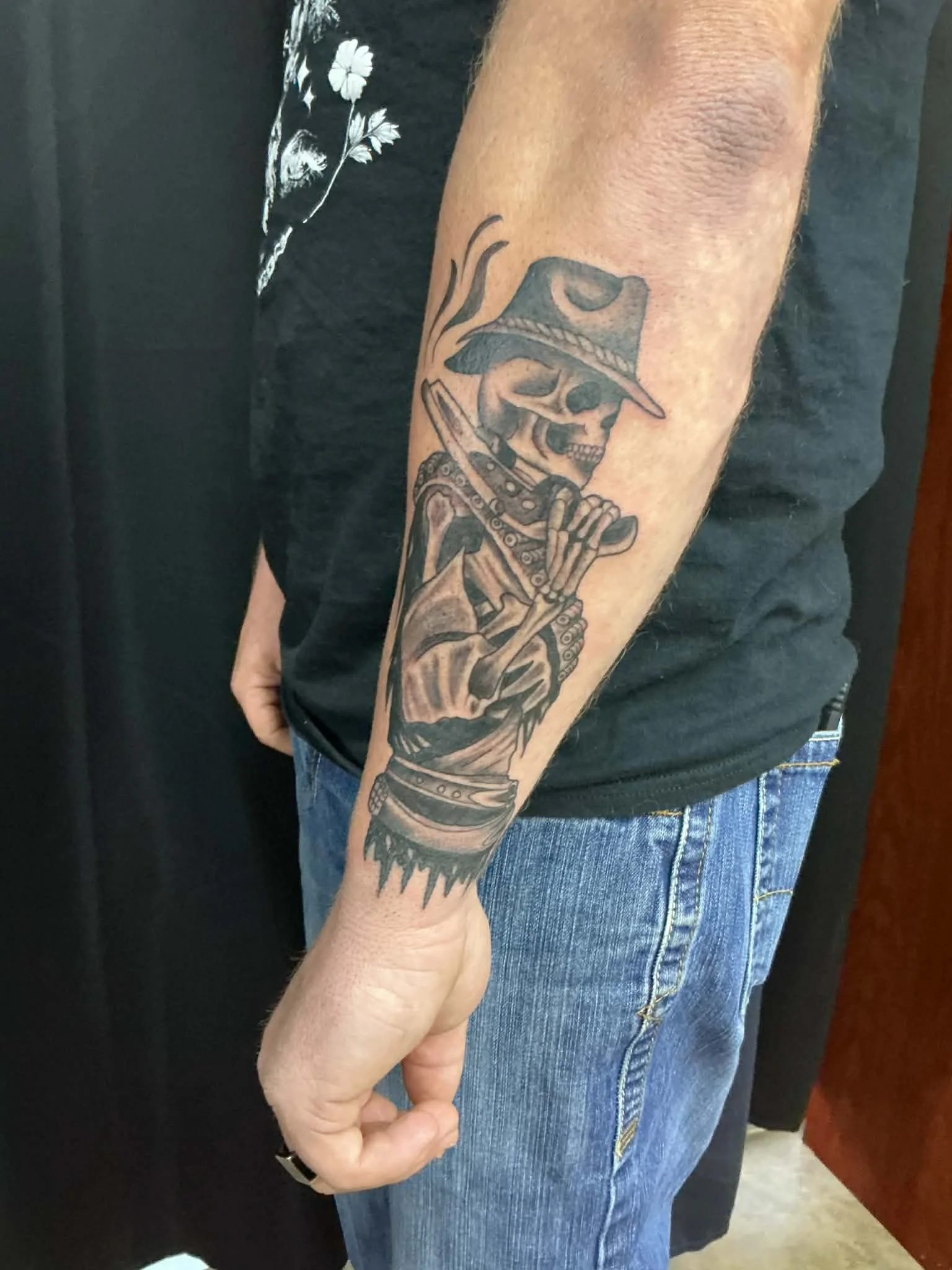 Black & grey dead cowboy tattoo