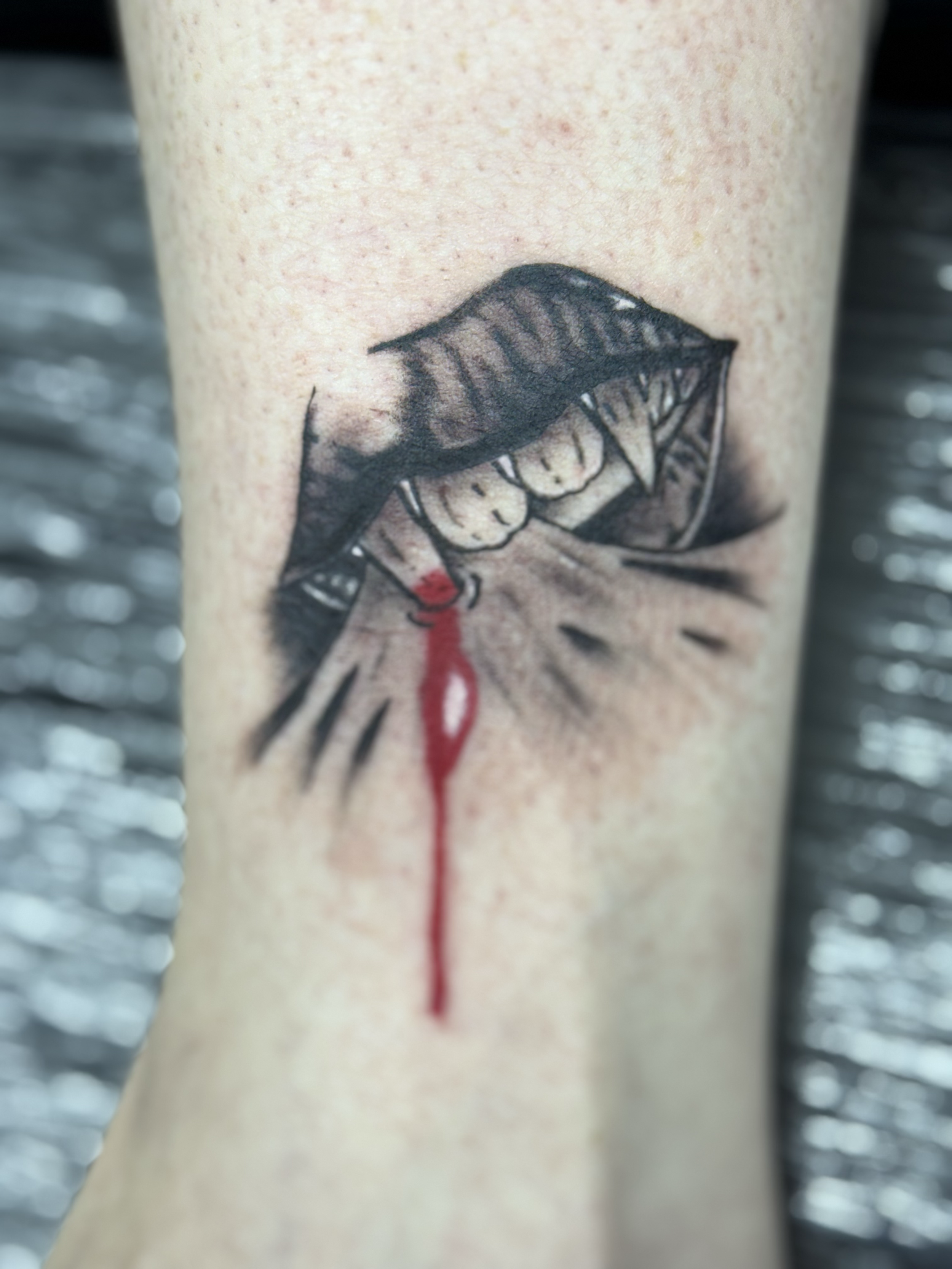 Illustrative vampire lips tattoo