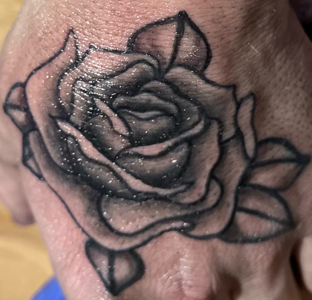 Black and grey rose tattoo