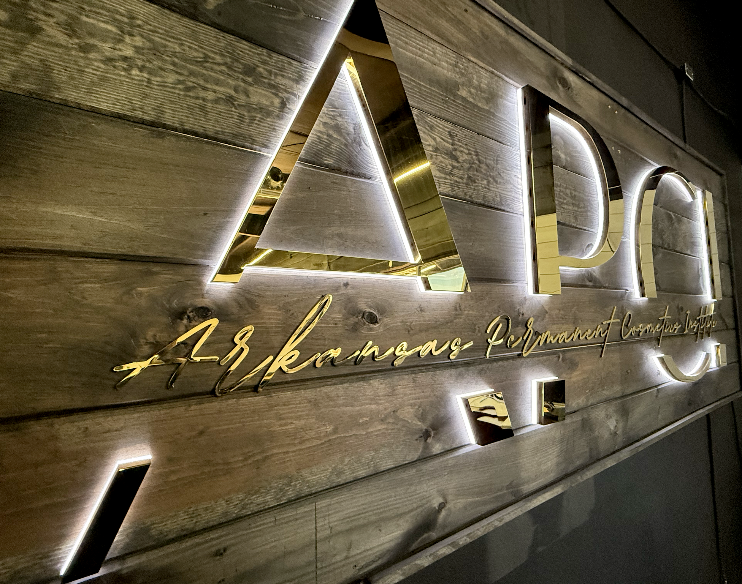 Arkansas Permanent Cosmetics Institute front desk sign, welcoming new students.